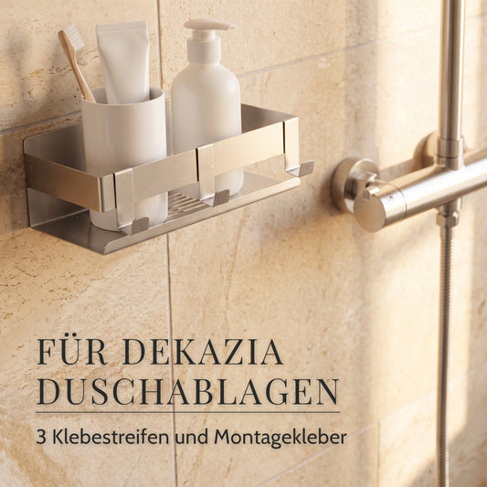 Edelstahl-Duschablage mit Becher, Tube und Pumpflasche an der Fliese: das Klebeset passt für alle DEKAZIA Duschablagen
