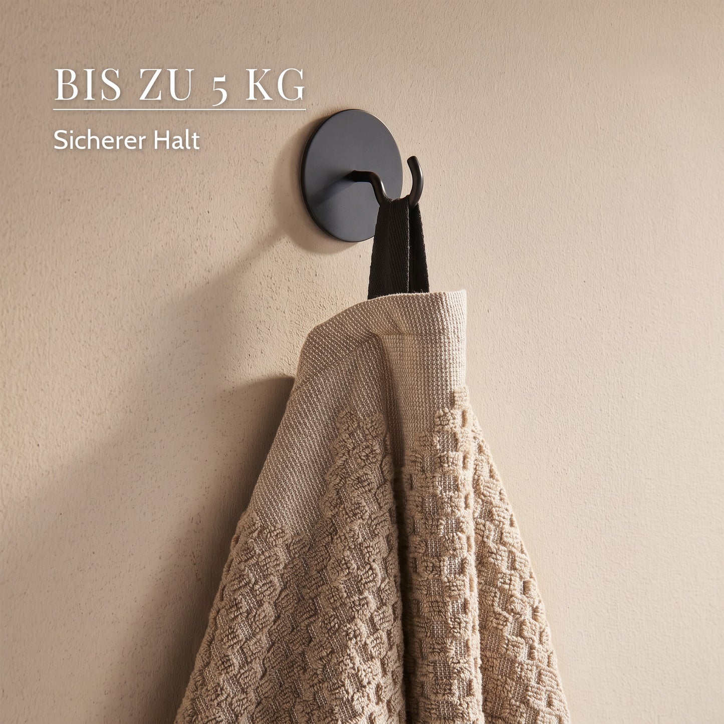 Schwarzer Rundhaken mit Handtuch